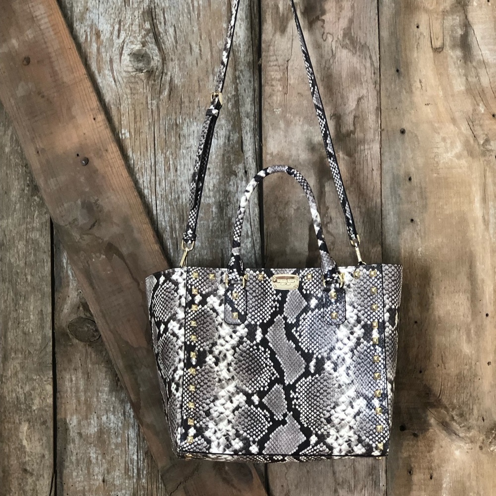 Michael Kors Studded Snake Print handbag with crossbody strap.